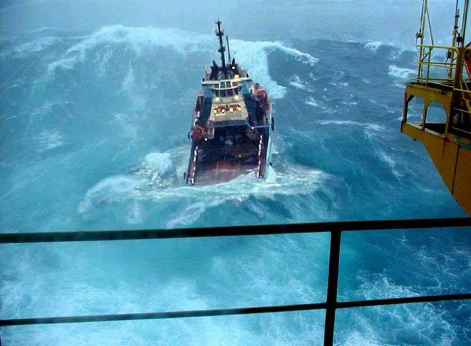 shipping vessel in rough ocean swell